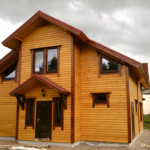 Отделка стен дома имитацией бруса